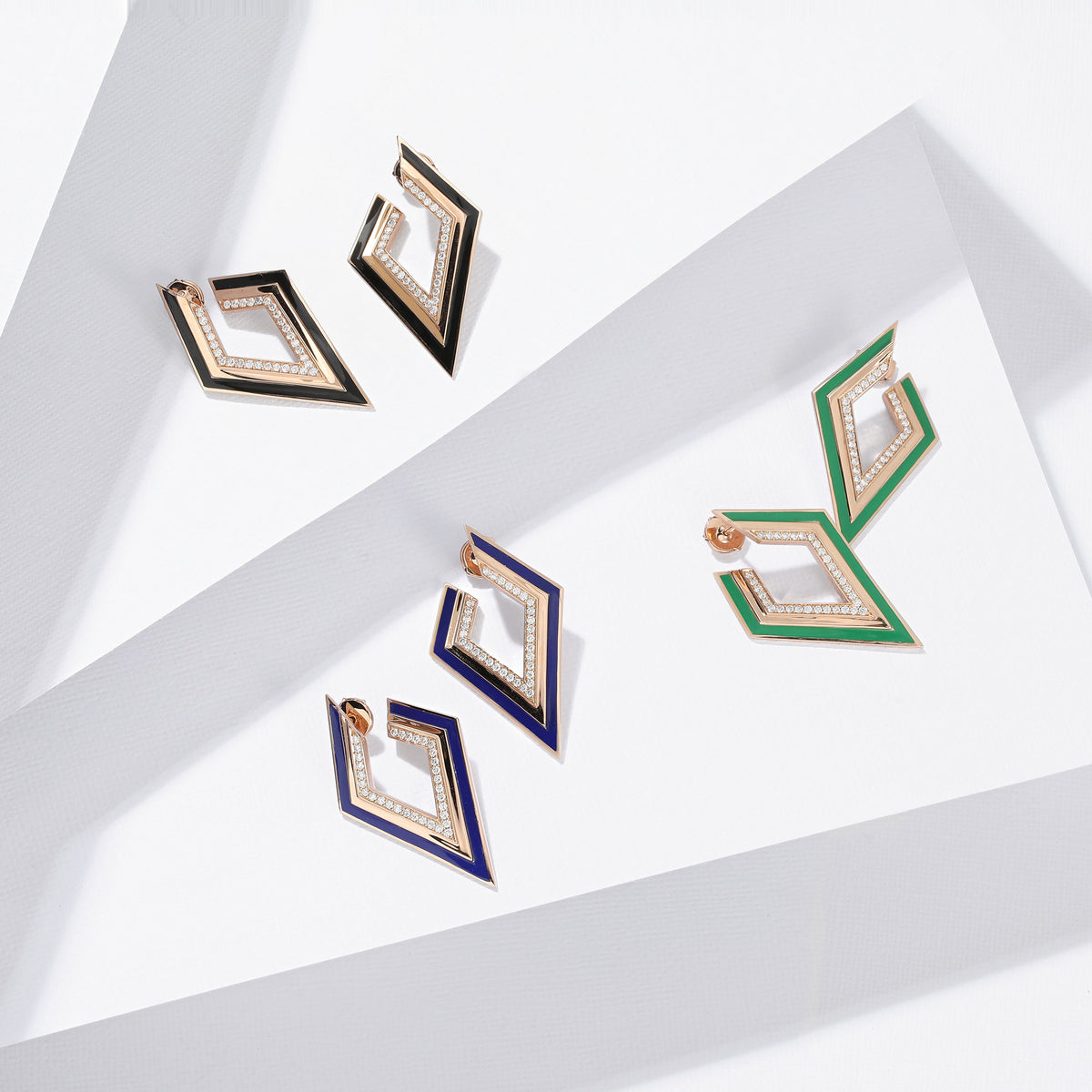 Our 18k rose gold kite earrings with diamonds and three enamel colors, green, blue, and black