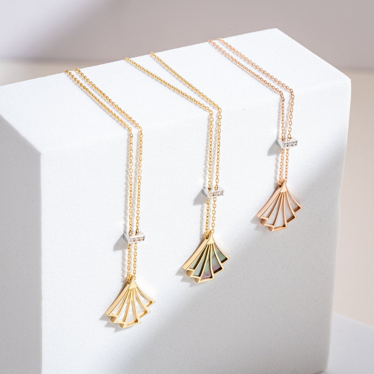 Our Finesse Debut necklaces come in rose and yellow gold with diamonds and natural mother of pearl